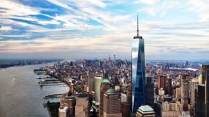 Wide shot of One World Observatory with Manhattan spreading out in the background